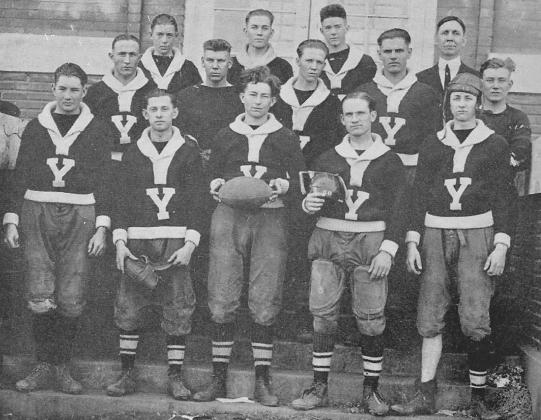 Glen Carson lined up at tackle for Yukon High School. Carson is wearing a leather football helmet, far right on the front row, during his senior year. Photo / Provided