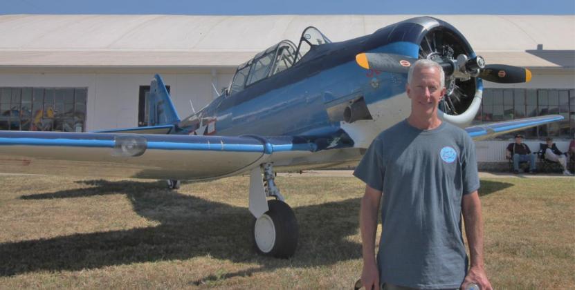 As part of the Sept. 25 “Fly-In &amp; Community Day” at the El Reno Regional Airport, Steve Afeman shows off his World War II SNJ. Photo / Carol Mowdy Bond